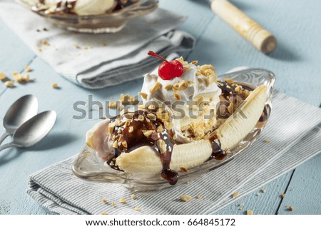 Sweet Homemade Banana Split Sundae with Chocolate Vanilla  Strawberry Ice Cream Royalty-Free Stock Photo #664845172