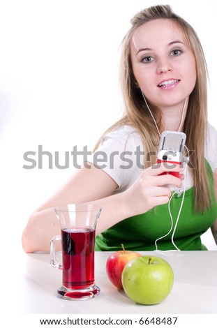 view of young nice girl listening music via mobile phone