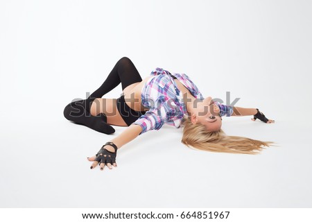 Girl gymnast. Young girl doing gymnastic exercises isolated