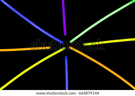 Glow sticks neon light fluorescent on back background. variation of different colored chem lights
