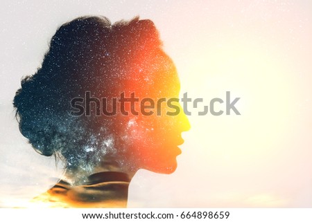 Dreamer with stars inside her head Royalty-Free Stock Photo #664898659