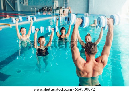 Aqua aerobics, healthy lifestyle, water sport Royalty-Free Stock Photo #664900072