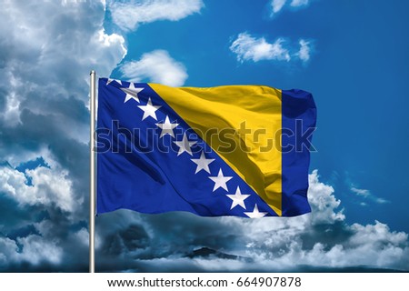 bosnian flag with sky background Royalty-Free Stock Photo #664907878