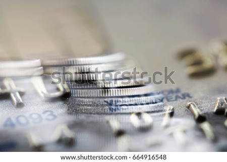 Double exposure Rows of coins of Credit cards on the table,finance and business concept,Money,soft focus and blurred style,dark tone.