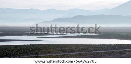 Drought stricken Lake Isabella at sunrise in the Sierra Nevada mountains in Central California USA