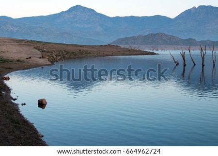 Drought stricken Lake Isabella at sunrise in the Sierra Nevada mountains in Central California USA