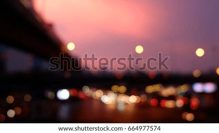 Traffic at evening time with pink and violet sky. (Blur mode to use for background) 