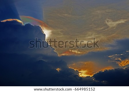 Irisation texture background and texture with light phenomenon, 
iridescent pileus, rainbow cloud and sunset sky background before raining
