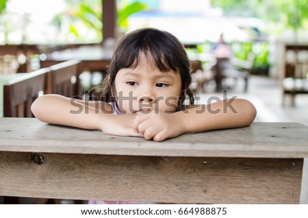 Asian Child lonely in a park
