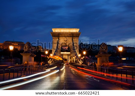 The long exposure image of Széchenyi Chain Bridge  which linked between 2 sides of Danube river with Buda Castle in the background during blue hour in Budapest, Hungary.