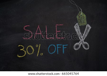 Sale 30% off. Sale and discount price sign with scissors cutting price tag drawn with chalk on blackboard