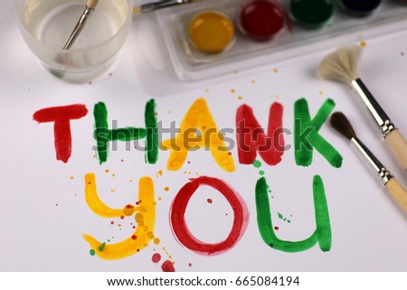 inscription on a white sheet of paper with watercolors "Thank you"