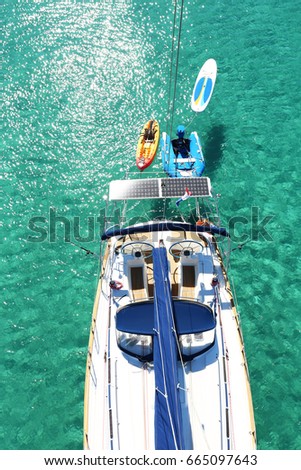 Sailboat in the middle of the transparent water