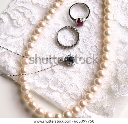 Lots of jewelry on white background.