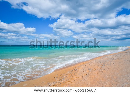 Beach sand and sky with clouds