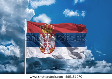 Serbia flag with sky background