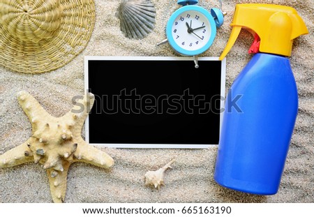 Photo with black background and beach accessories in the sand