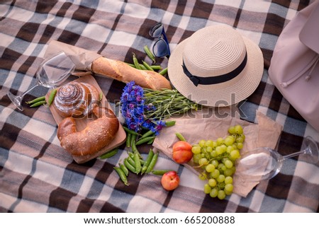 Picnic food and fruit on the seashore. French summer outdoor meals. Meals and relax on the beach 