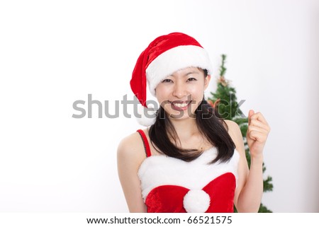 pretty christmas girl in red dress and santa hat