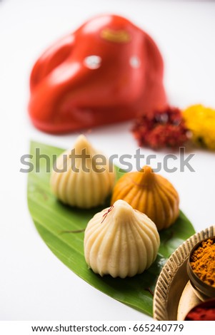 Indian sweets Modak which is offered as prasad to Elephant headed god called Lord Ganesha on chaturthi with Pooja Thali