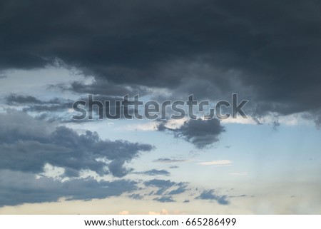 Beautiful, sky before a storm, overhanging dark clouds. City landscape.
