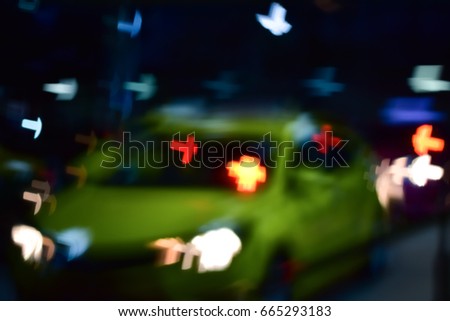 Blur street bokeh with colorful lights in night time for background usage,Bokeh from the fire of the car,Can be used for travel tasks.