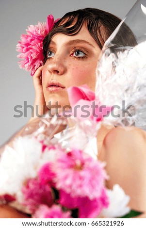 Girl with pink peony fashion photo