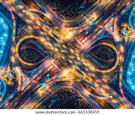 Road beautiful Aerial View of Busy Intersection , top view , Thailand at night Royalty-Free Stock Photo #665338459