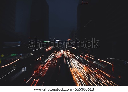 Light trails on the building background in Bangkok,Thailand.