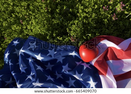 American flag and heart on the ground. Selective focus
