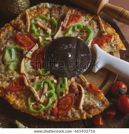 Hot true PEPPERONI ITALIAN PIZZA with salami and cheese. TOP VIEW Tasty traditional pepperoni pizza on board on white wooden table with decoration. Copy space for your logo. Ideal for commercial