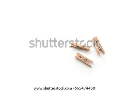 Brown wood clothes peg or clothespin on white background. Royalty-Free Stock Photo #665474458