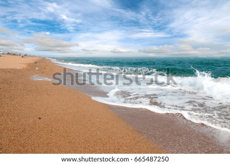 Beautiful sandy beach and blue sunny sky over the Mediterranean coast