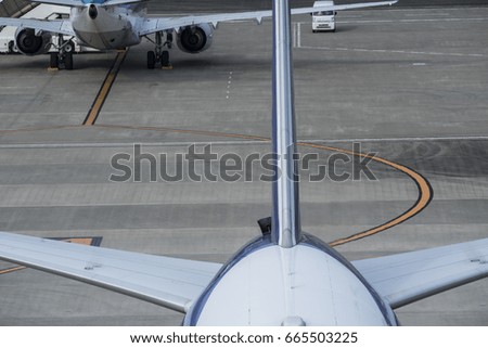 Close-up photograph of an airplane stopped at the airport.