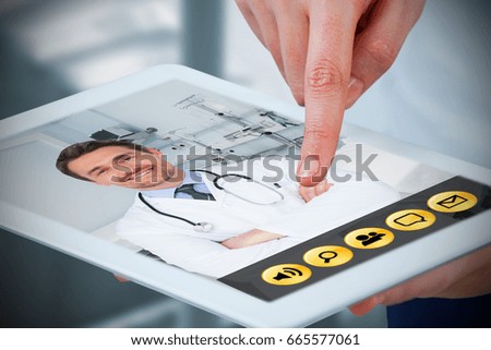 Hands using digital tablet against white background against sterile bedroom