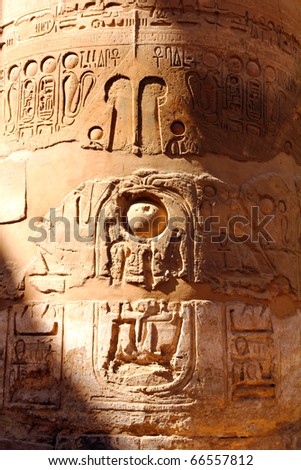 column in karnak temple with ancient egypt hieroglyphics