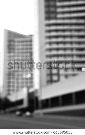 black and white blurred view of city architecture