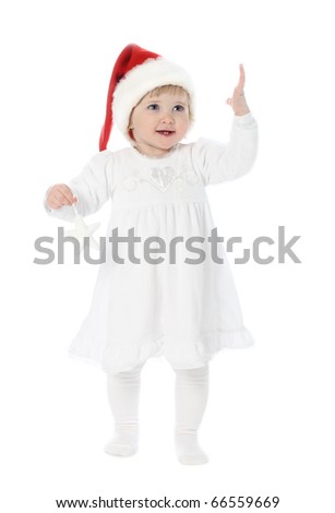 Cute happy smiling baby girl enjoying Christmas tim