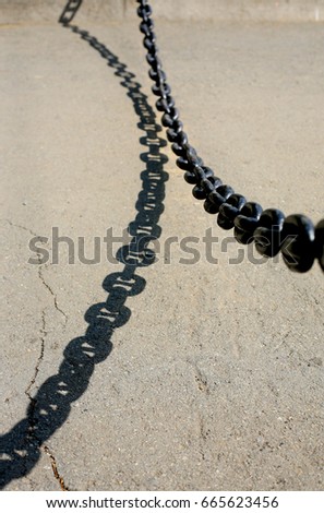 metal chain which is blocking off traffic on road