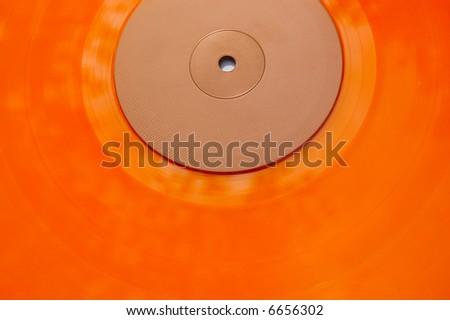Colored orange vinyl record texture. Abstract background.