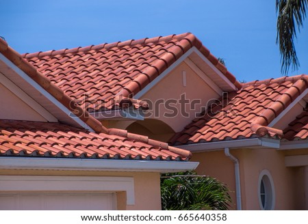 Florida home with spanish tiled roof Royalty-Free Stock Photo #665640358