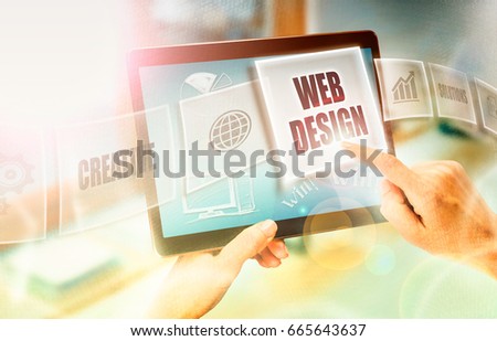 A businesswoman selecting a Web Design business concept on a futuristic portable computer screen.