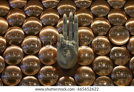 Buddhism palm on golden circle background at New Delhi International Airport