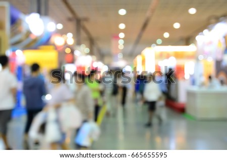 Blurred image of people shopping in a commercial fair
