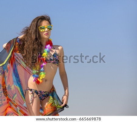 Beautiful young woman in hawaii costume.