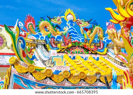 colorful Chinese dragon in clear sky above the shrine at Pattani,