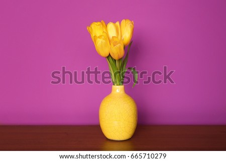 Bouquet of beautiful tulips on lilac color background