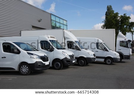 Several cars vans and trucks parked in parking lot for sale Royalty-Free Stock Photo #665714308
