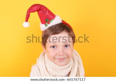 cute little boy wearing Santa Claus cap