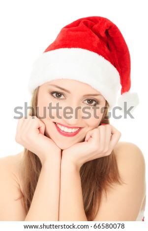 Picture of pretty christmas girl in red dress and santa hat, smiling isolated on white background